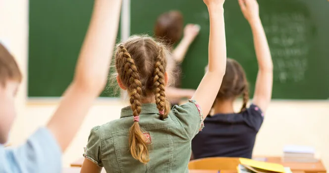 Girl in classroom. Credit / Shutterstock